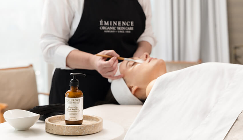 A woman receiving a facial